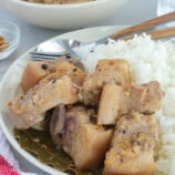 White pork adobo on a plate with steamed rice.