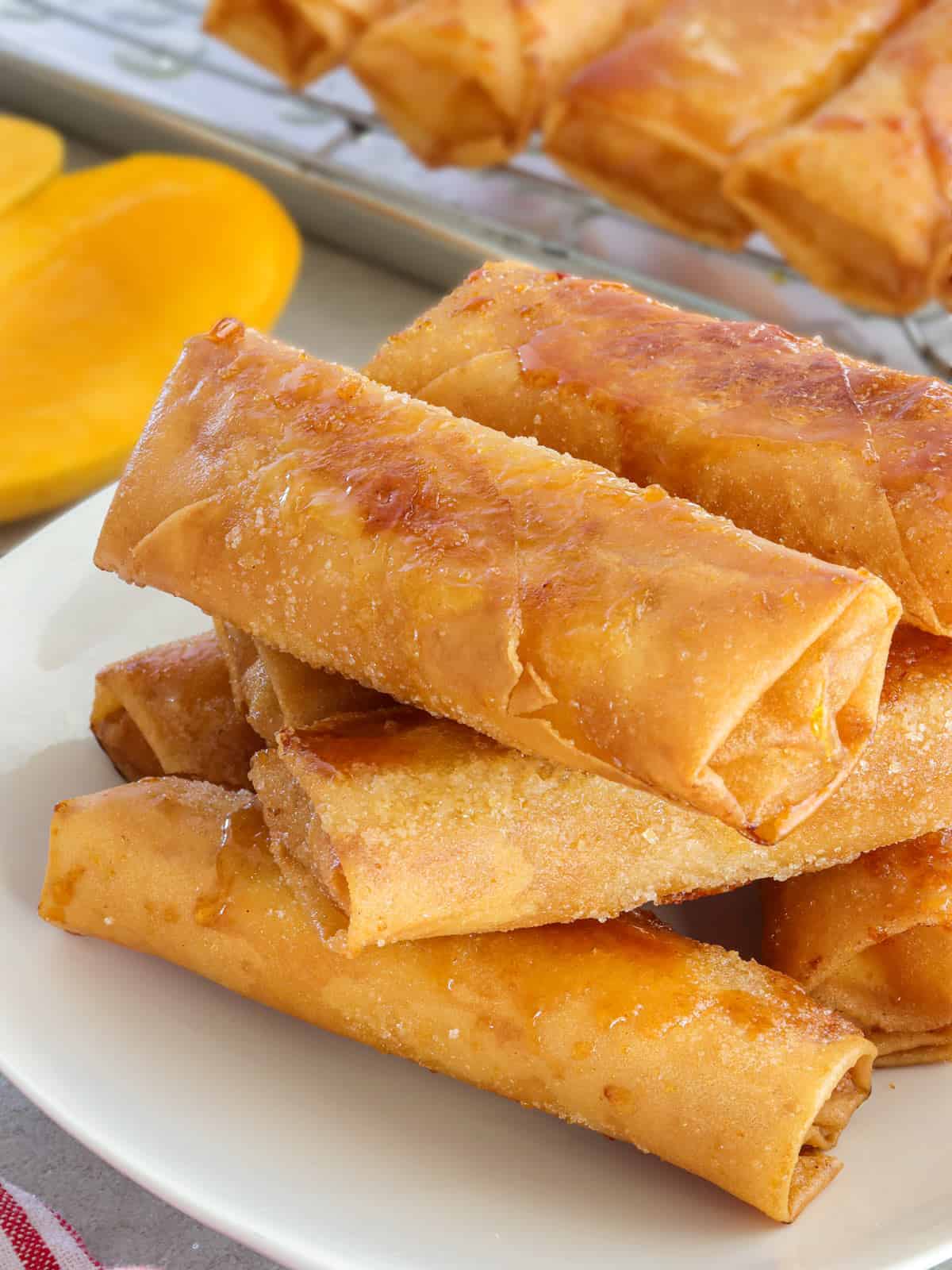 Mango and Cream Cheese Turon on a white plate.