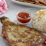 eggplant omelette on a plate with steamed rice and ketchup.